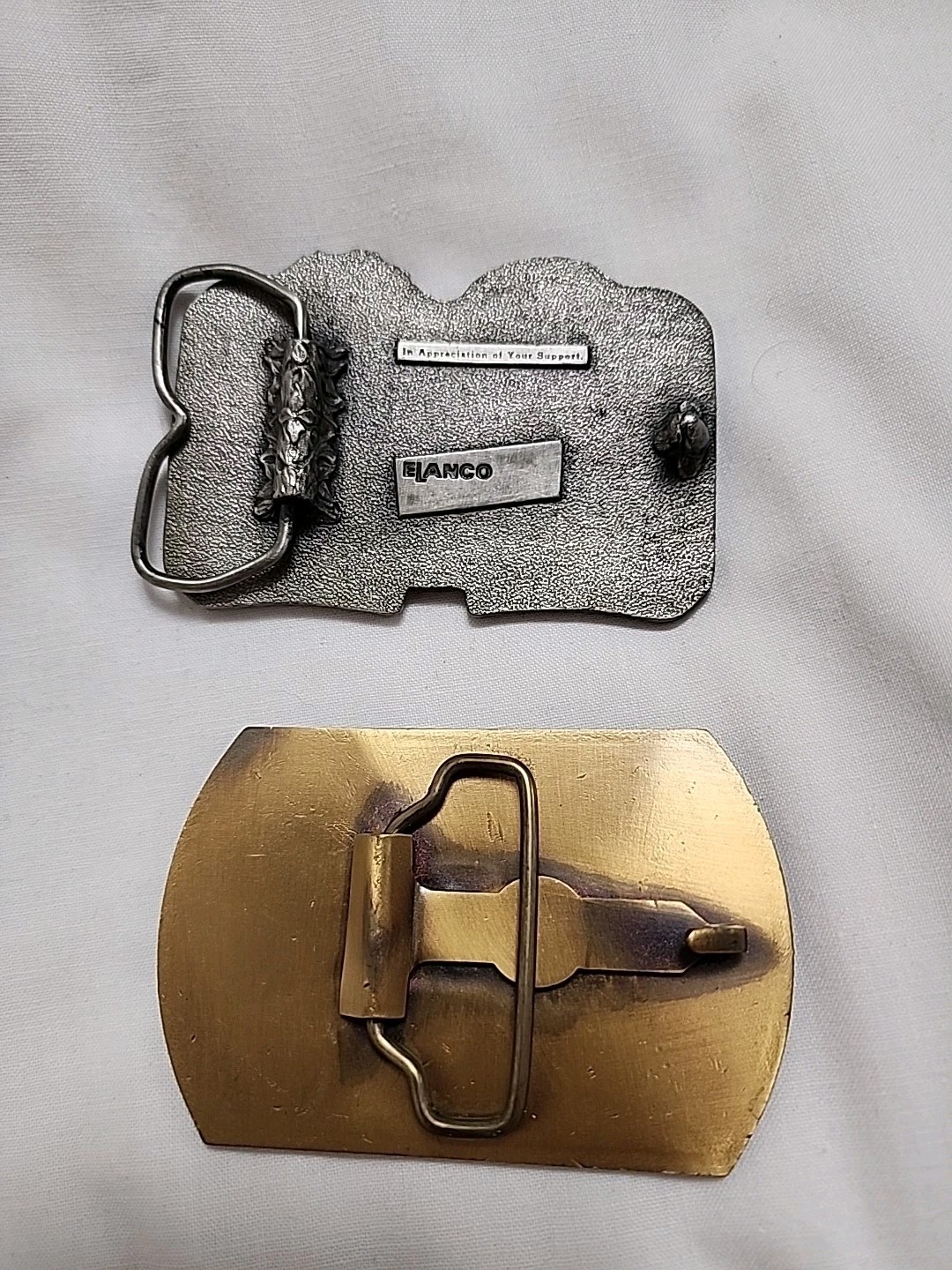 GTA & Treflan Ad Belt Buckles
