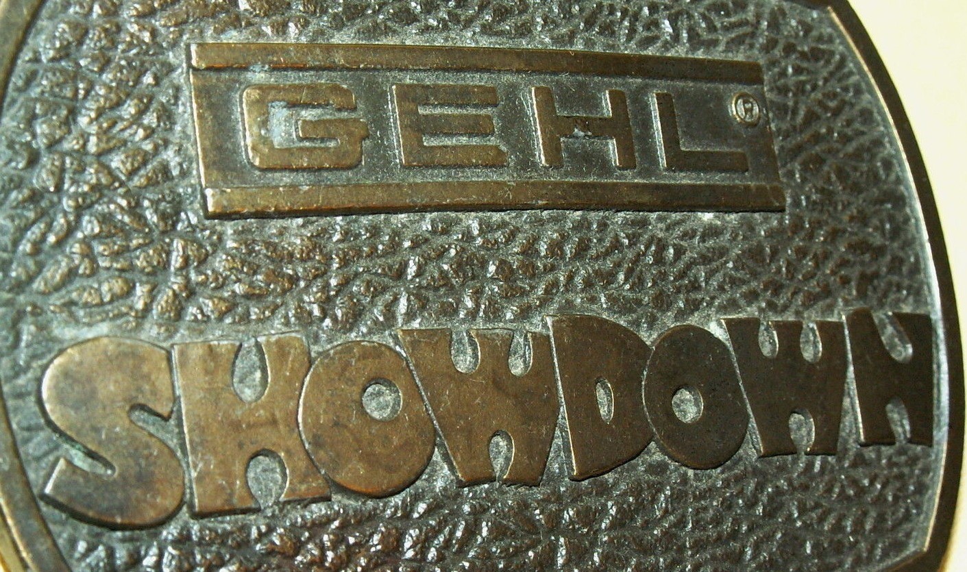 GEHL SHOWDOWN BELT BUCKLE BERGAMOT BRASS WORKS 1976 WI USA FARM IMPLEMENTS OVAL.