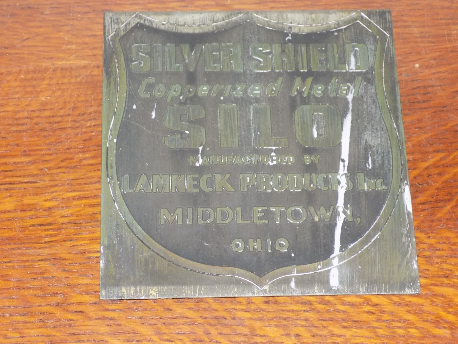 Vintage Silver Shield Copperized Metal Silo Sign