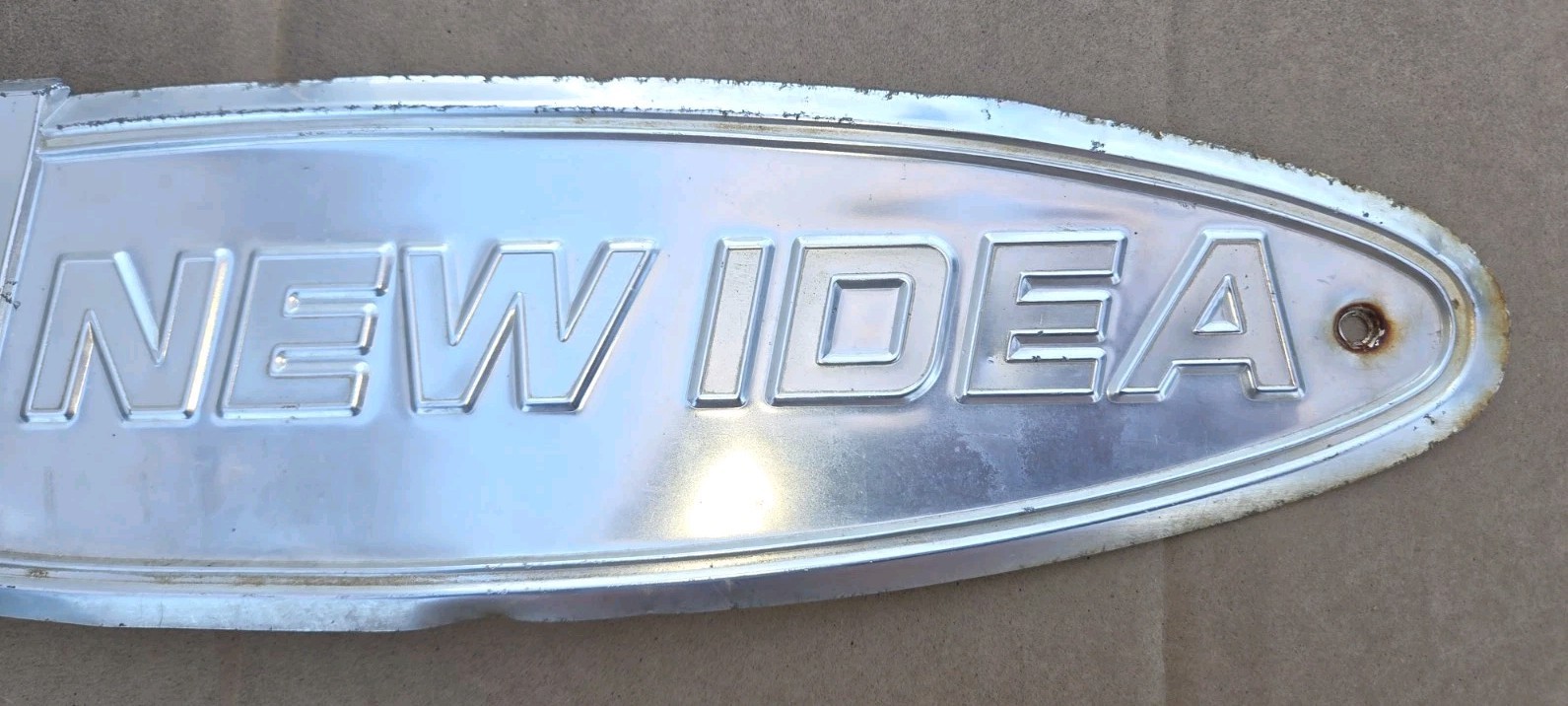 Vintage Avco New Idea Metal Sign Emblem
