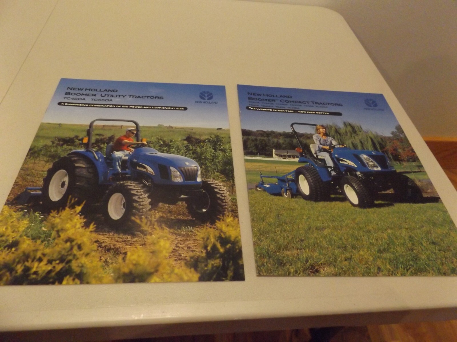 2-pc. NEW HOLLAND BOOMER UTILITY & COMPACT TRACTORS, LIT # NH1050336, NH1050349