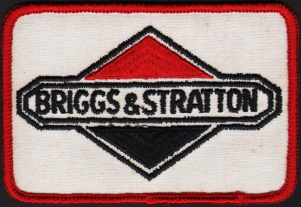Vintage uniform patch BRIGGS and STRATTON red white and black unused n-mint
